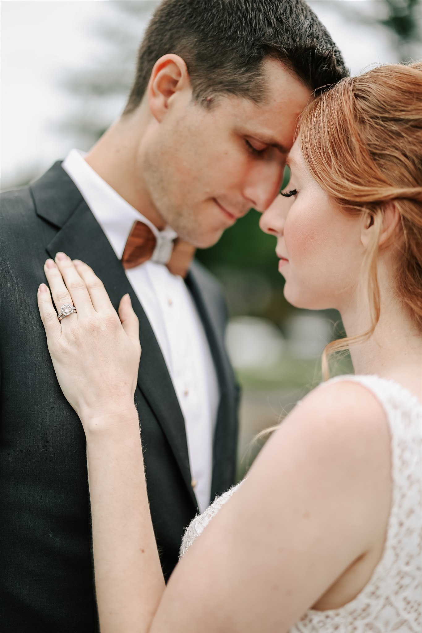 bride and groom with their foreheads together at their American Creek Lodge Wedding