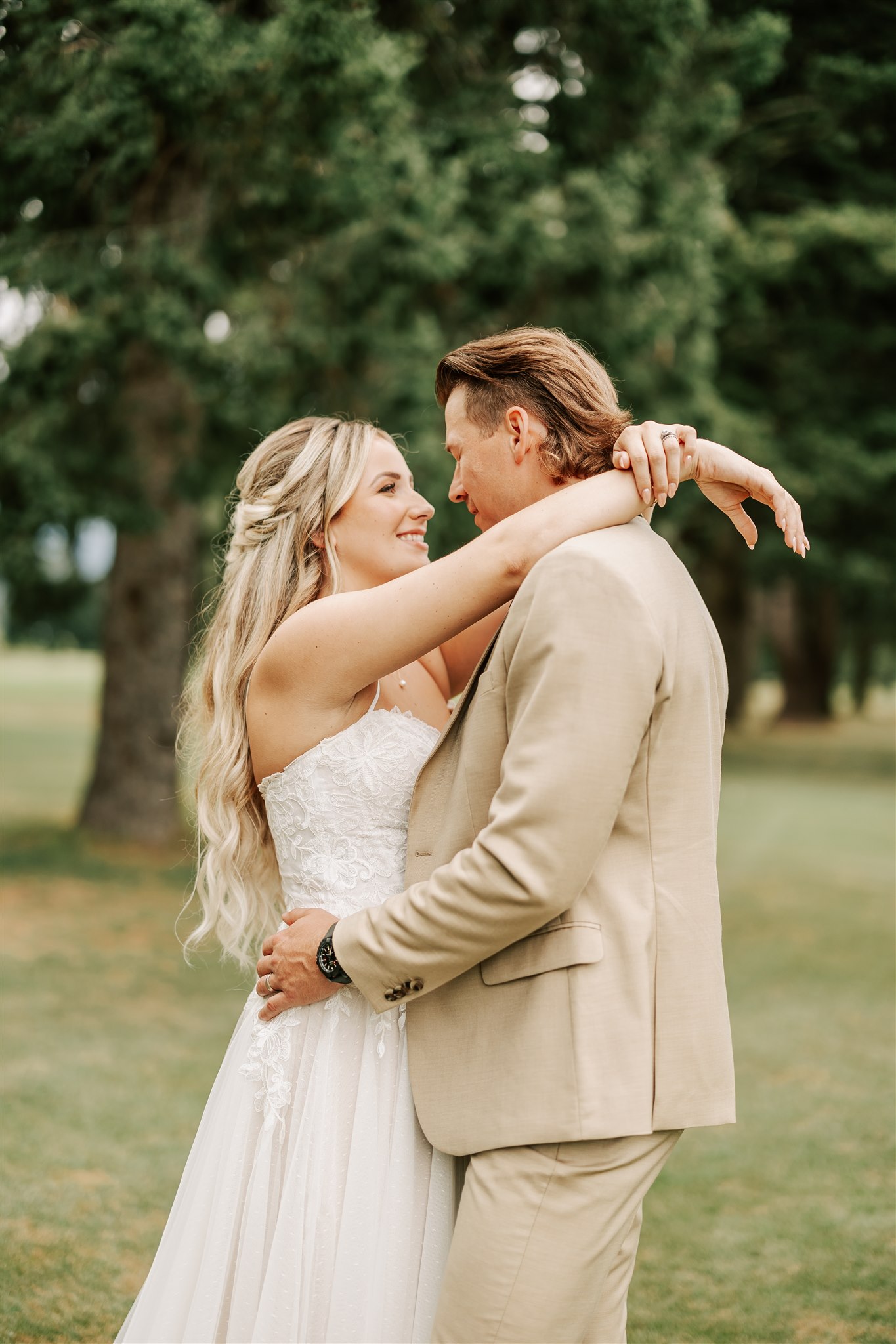 bride and groom holding each other