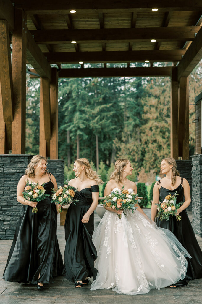 A bride and her bridesmaids having a good time during their portrait session